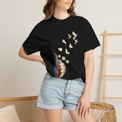Milkweed Takes Flight Tee worn Printify context view on a Black Comfort Colors 1717 tee